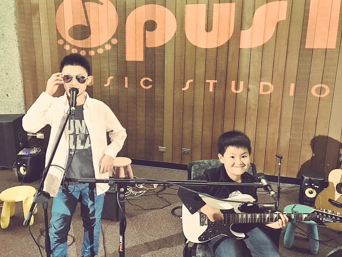 Opus 1 guitar student performing
