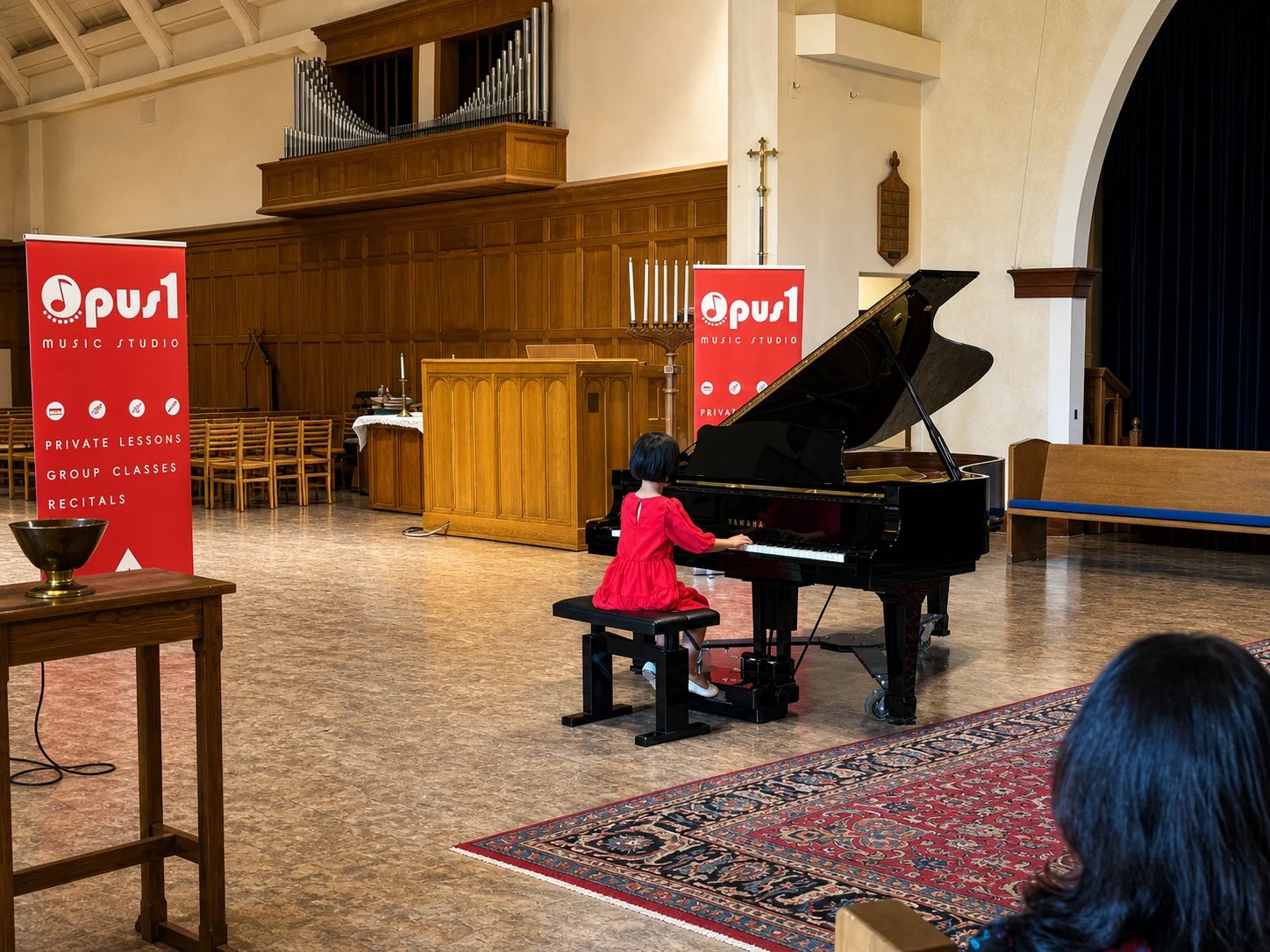 Young pianist performing at Opus 1