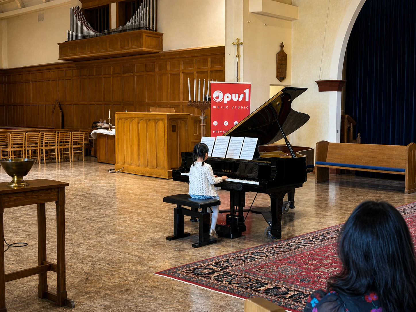 Pianist performing at Opus 1 Music Studio