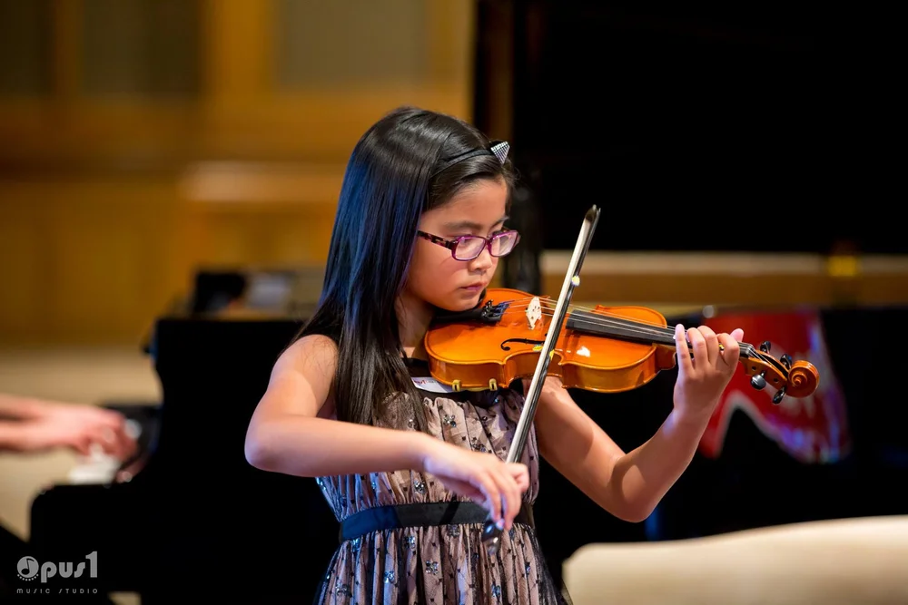 Violin student in performance